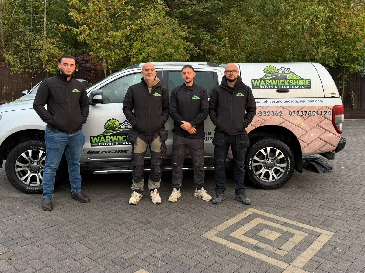 The Warwickshire Drives and Landscapes team with their branded pickup